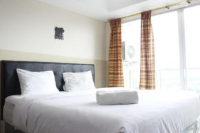 Modern Studio Room at Tamansari La Grande Apartment By Travelio